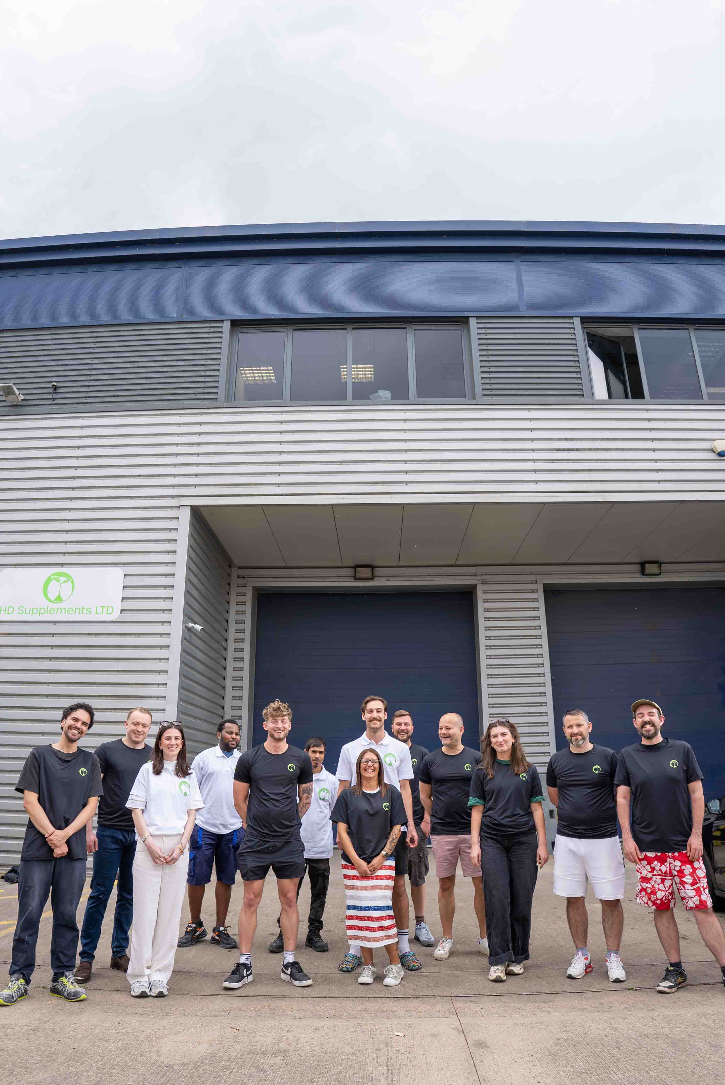 Logan and the Natural Foundation Supplements team outside their GMP facility
